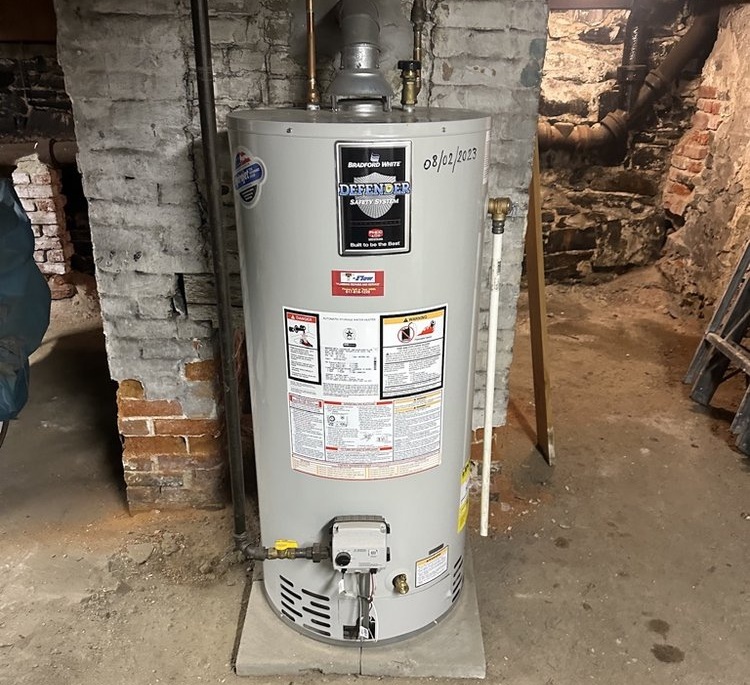 Professional water heater installation in a Boston basement